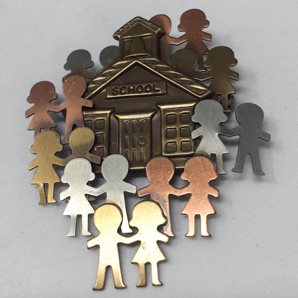 School pin signed K & T students and school house